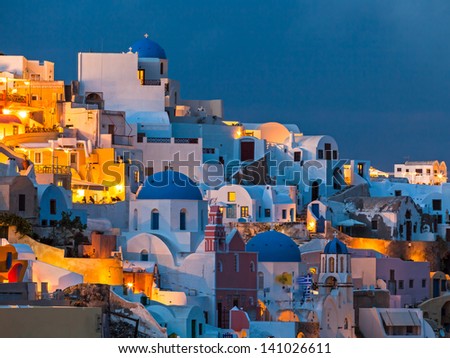 Night shot of houses and churches at Oia Santorini Greece