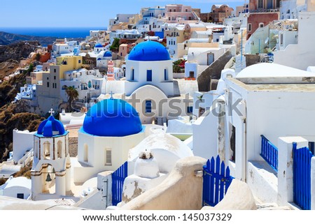 Blue domed churches on the Caldera at Oia on the Greek Island of Santorini.