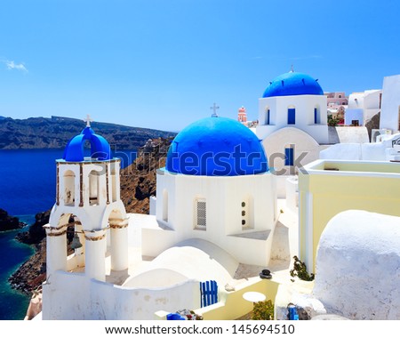 Blue domed churches on the Caldera at Oia on the Greek Island of Santorini.