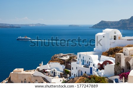 Ship passing Oia on the Island Of Santorini Greece Europe