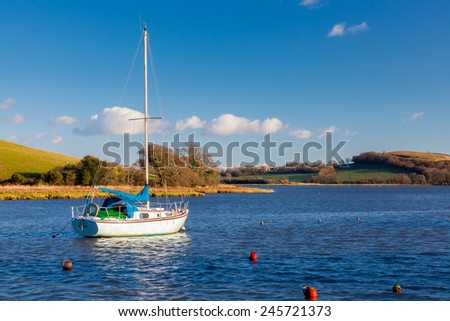 Yacht moored off the quay at St Germans Cornwall England UK Europe