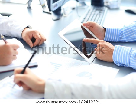 Business adviser analyzing financial figures denoting the progress in the work of the company