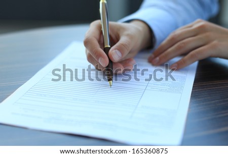 Business lady taking business notes at office