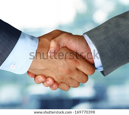 Closeup Of A Business Hand Shake Between Two Colleagues