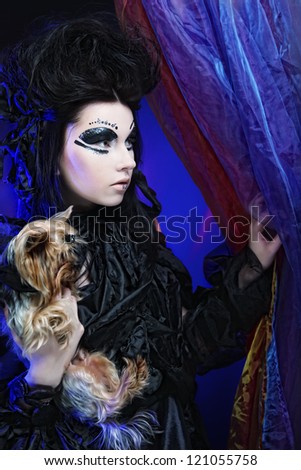 elegant dark queen with little dog
