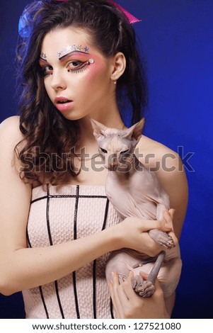 young princess with Sphynx cat. creative fantasy make-up.