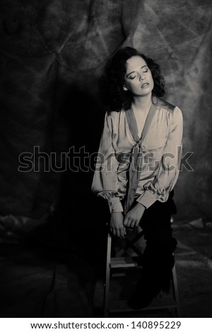 Portrait of beauty young woman with curly hair - black and white image