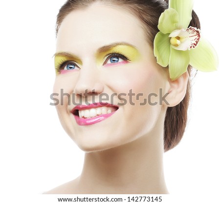 Beauty Portrait. Beautiful stylish girl with orchid flower in hair.
