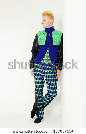 young fashion man full body a in the studio