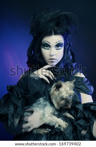 elegant dark queen with little dog
