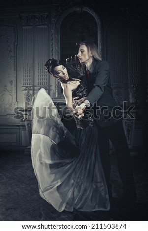 Beautiful couple in love in historical palace. Luxury.