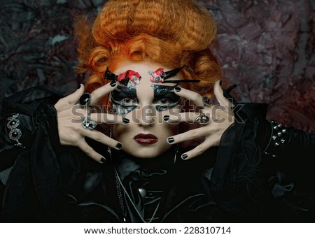Gothic redhair witch. Dark woman.Halloween picture.