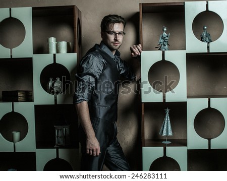 Fashion young man in luxury modern interior