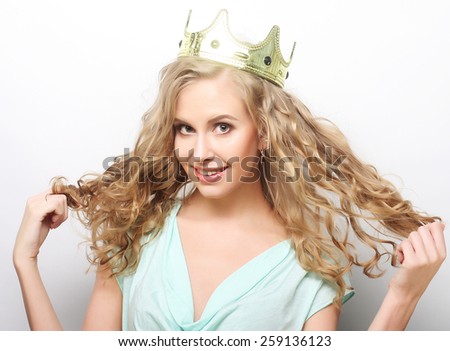 young lovely expression woman in crown