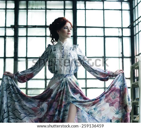 young elegance woman with flying dress in palace room