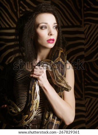 young beautiful woman with a snake