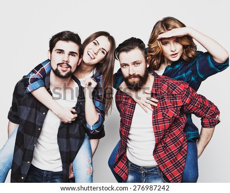 emotional, happiness and people concept: Group Of Young People Giving Piggybacks over white background.Special Fashionable toning photos.