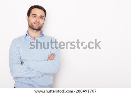 life style  and people concept: happy young man in blue shirt. Over white background.