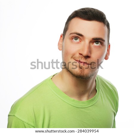 life style  and people concept: happy young man in green t-shirt. Isolated on white.
