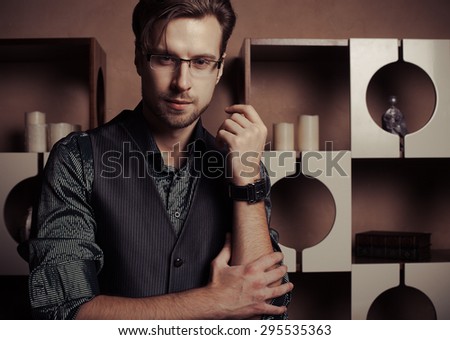 Fashion young man in luxury modern interior