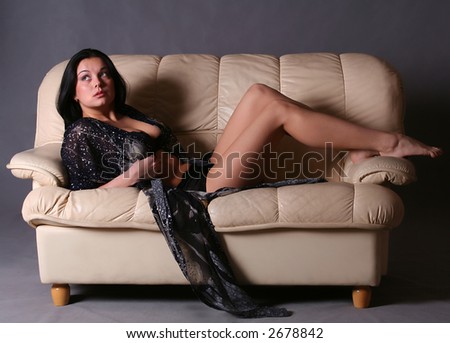 Beautiful sexy girl laying on sofa