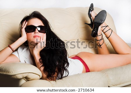 Sexy lingerie female model on sofa