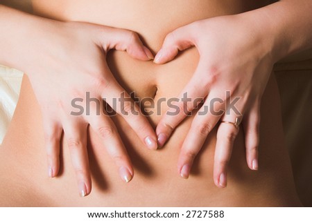 Woman's Fingers Touching her body parts, heart shaped fingers