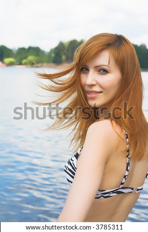 Attractive girl at beach having fun in the sun