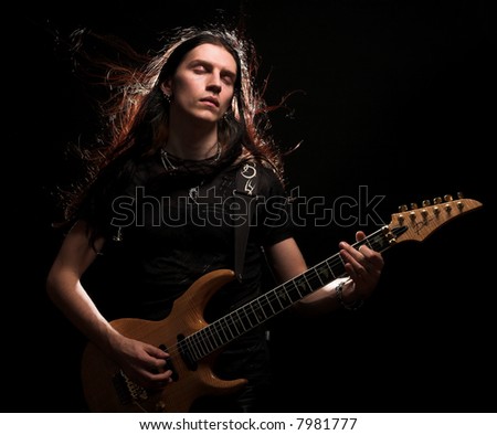 http://image.shutterstock.com/display_pic_with_logo/81677/81677,1198258068,2/stock-photo-man-playing-electrical-guitar-wind-in-hair-7981777.jpg