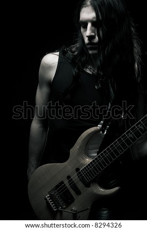 http://image.shutterstock.com/display_pic_with_logo/81677/81677,1199628884,1/stock-photo-man-with-long-hair-playing-electrical-guitar-8294326.jpg