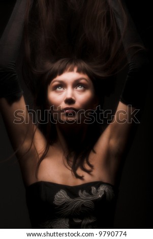 young black hair woman portrait on dark background