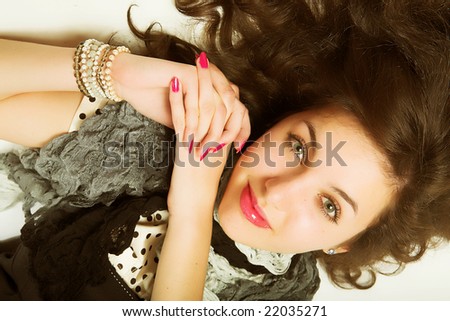 The House of the Powers Stock-photo-young-woman-with-long-brown-curly-hair-and-green-eyes-laying-on-floor-22035271