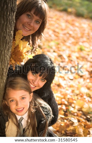 Family playing in autumn park