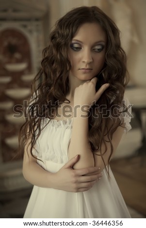 Beautiful happy young bride with long brown hair