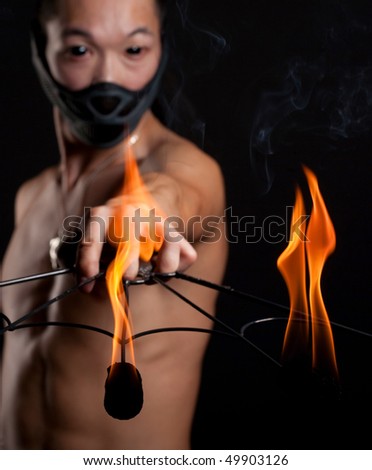 young asian man with fire show