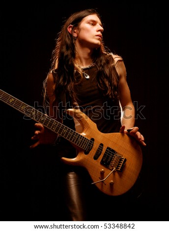 http://image.shutterstock.com/display_pic_with_logo/81677/81677,1274186743,2/stock-photo-man-with-long-hair-playing-electrical-guitar-53348842.jpg