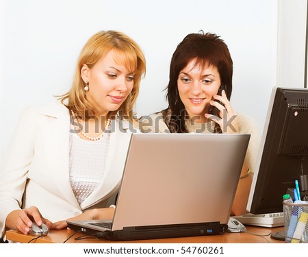 Two business women work in team