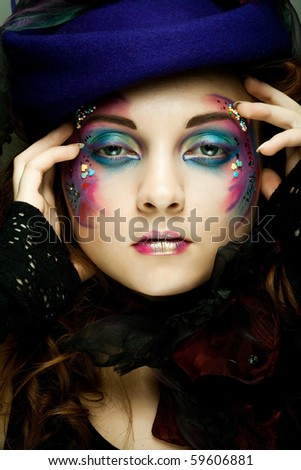 stock photo Beautiful woman in hat with artistic makeup Princess style