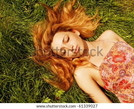 Beautiful Young Woman resting in the park