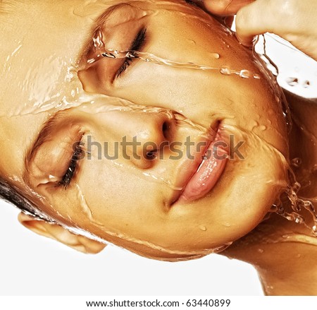 Close-up of beautiful wet woman face with water drop. On white background