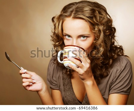 young pretty woman drinking coffee