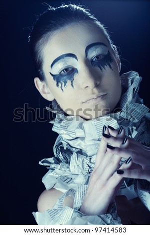 extravagant woman with dress paper news. Creative visage, Dark Side.