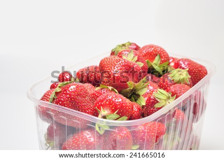 red fresh strawberries in transparent box