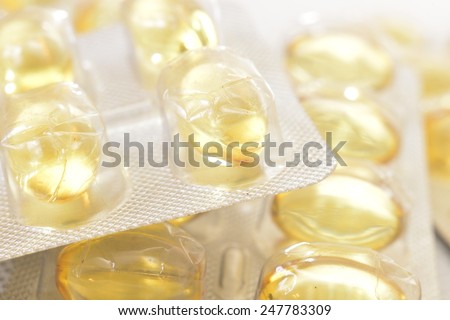 illuminated cod-liver  yellow transparent pills