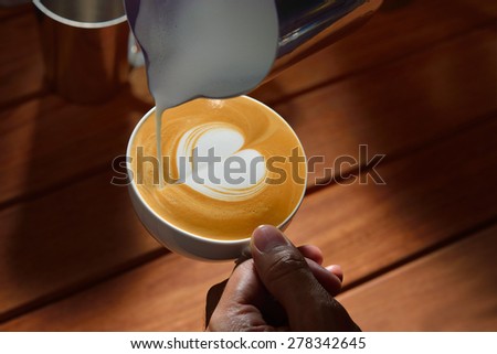 Making of cafe latte art, heart shape