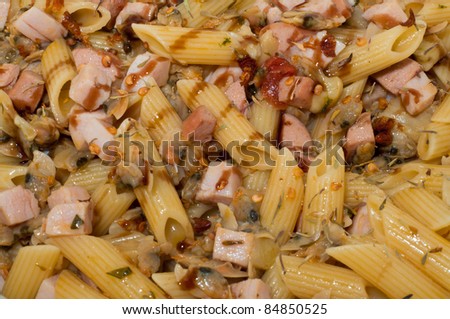 Italian pasta with clams and cooked ham to eat