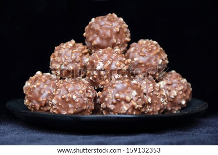 Image of brown sweet candy on black background