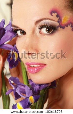 Beautiful woman with flower iris