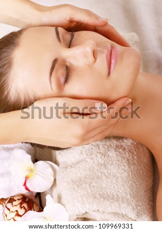 Portrait of Fresh and Beautiful brunette woman taking head massage
