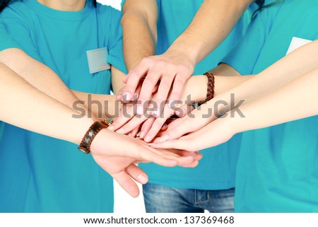 friends showing unity with their hands together